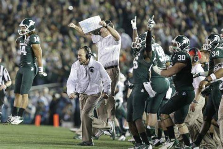 Mark Dantonio celebrates his recordsetting win The State News